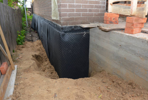 Happy homeowners after waterproofing job in Brush Creek